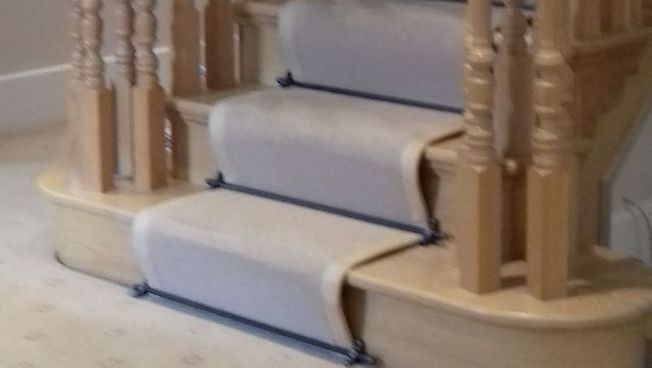 A carpet installed on some stairs 